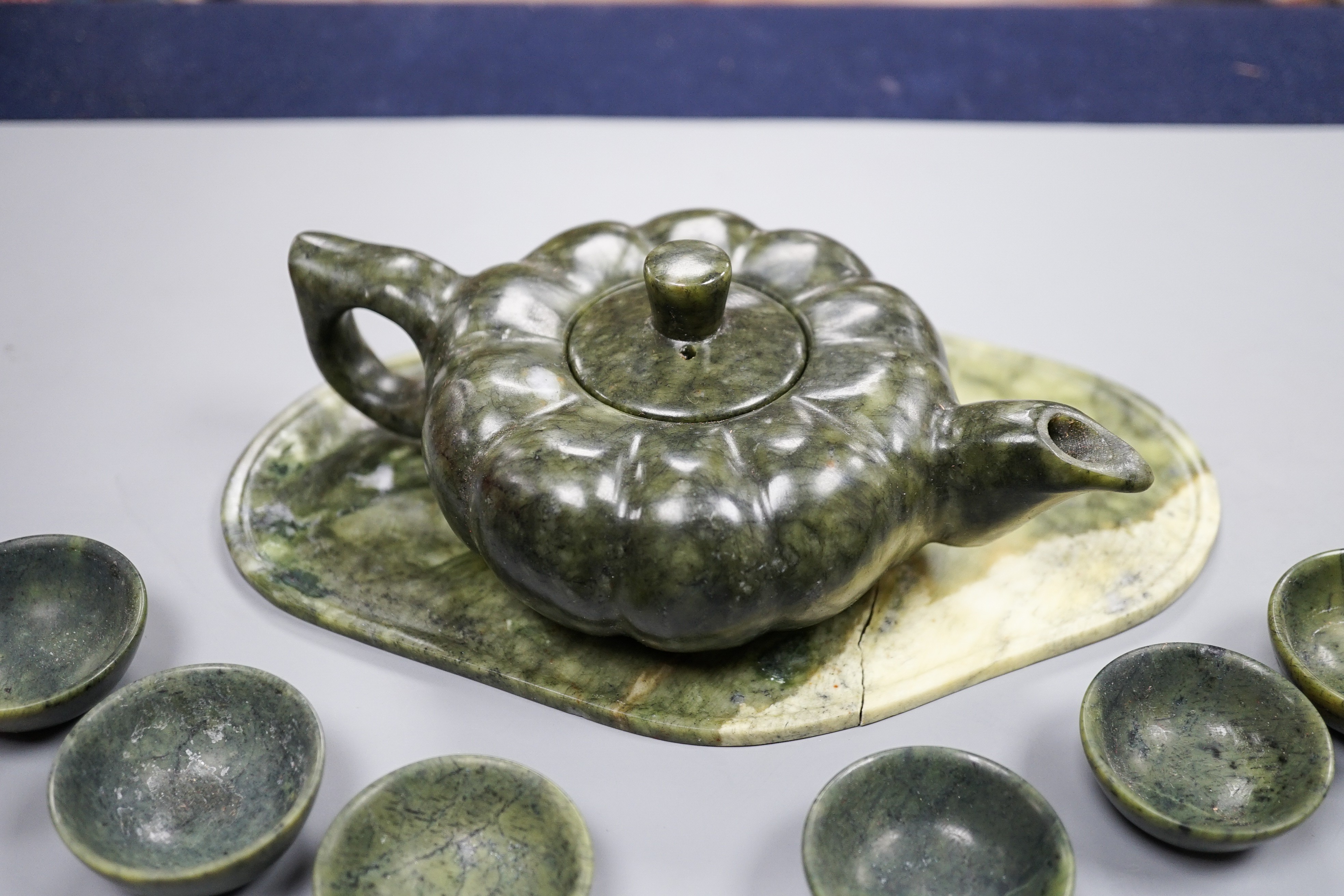 A spinach green jade melon shaped Chinese teapot and six cups (boxed)